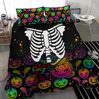 Black Halloween duvet with skeleton arms, colorful pumpkins, and Trick or Treat text