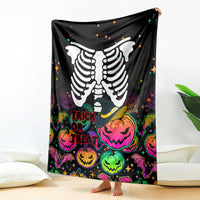 Black Halloween skeleton blanket with trick-or-treat pumpkins and colorful glow text