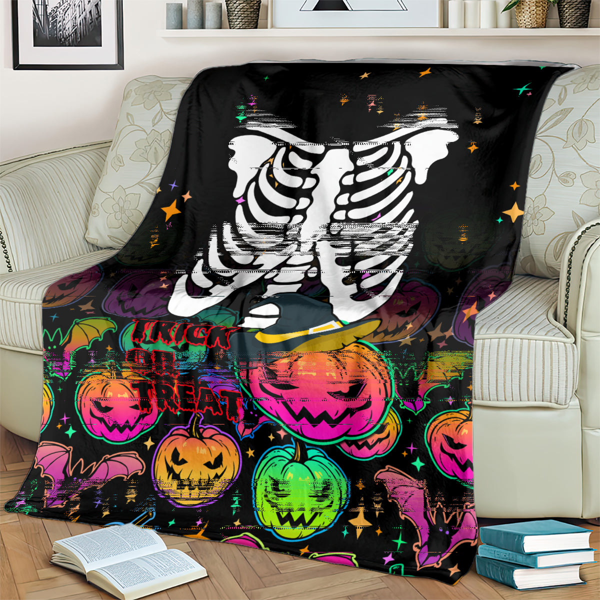 Black skeleton blanket with large white ribcage print and trick-or-treat pumpkins