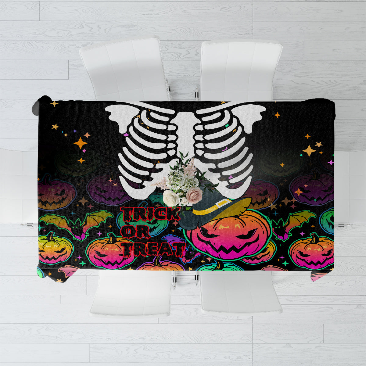 Black Halloween tablecloth with skeleton print, trick or treat lettering, pumpkins