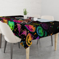 Black Halloween tablecloth with colorful jack-o’-lantern, bats, and star accents