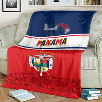 Panama-themed blanket coat on couch, blue and red halves with Panama text and coat of arms