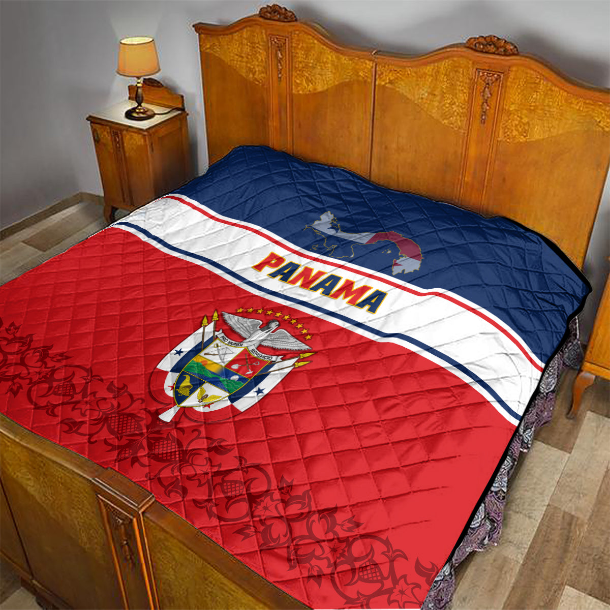 Panama Independence Day quilt coat on bedspread with blue top, red bottom, and Panama crest