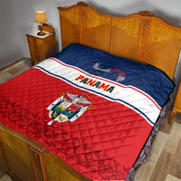 Panama Independence Day quilt coat on bedspread with blue top, red bottom, and Panama crest