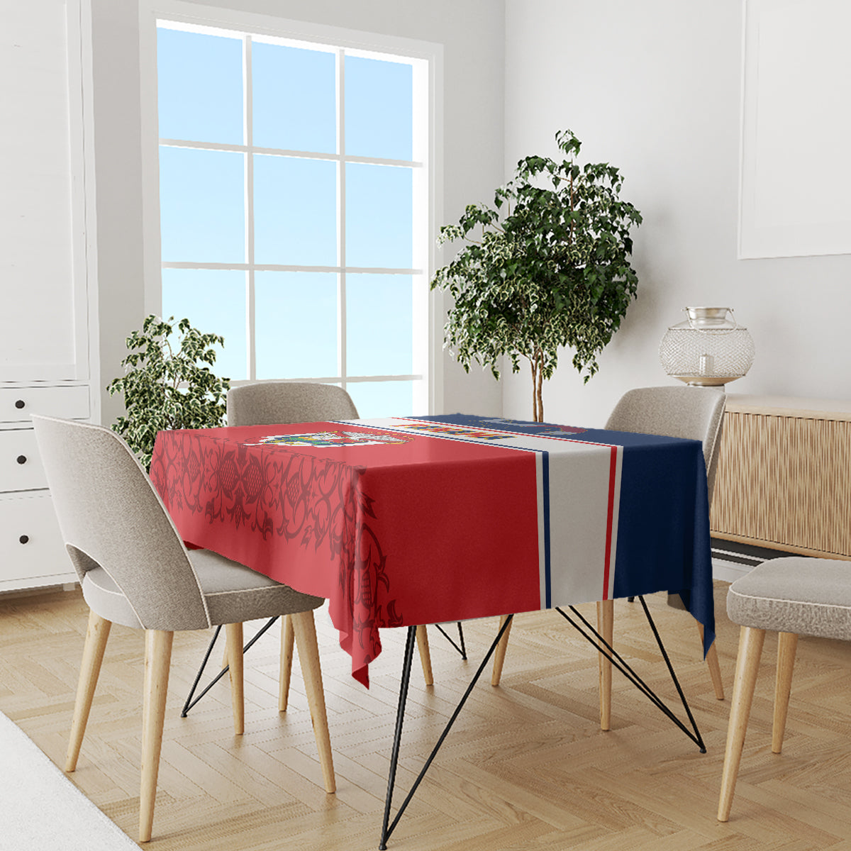 Red and navy-themed tablecloth with striped border on dining table with chairs
