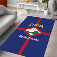 Blue area rug laid in living room, red cross stripe and STATIA logo