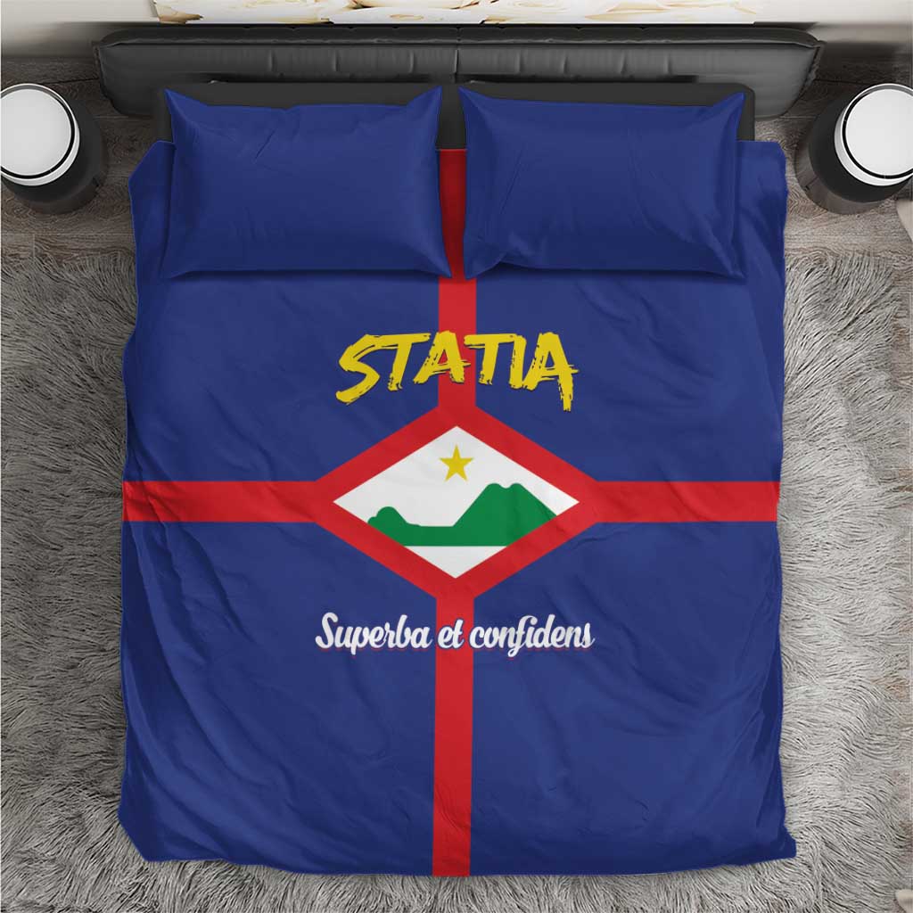 Blue Statia bedding set with crest and STATIA logo on comforter and matching pillowcases