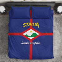Blue Statia bedding set with crest and STATIA logo on comforter and matching pillowcases