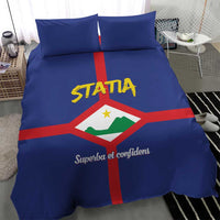 Blue duvet cover set with large STATIA crest, red cross stripes and two pillows