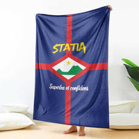 Blue blanket with red cross, white diamond coat of arms, and "Superba et confidens"