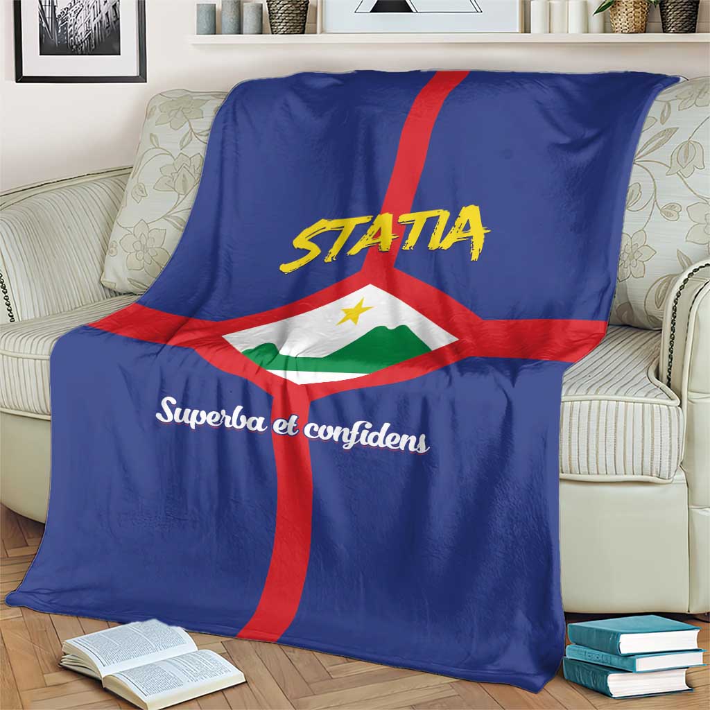 Blue blanket with red vertical cross, white diamond, yellow "STATIA" lettering