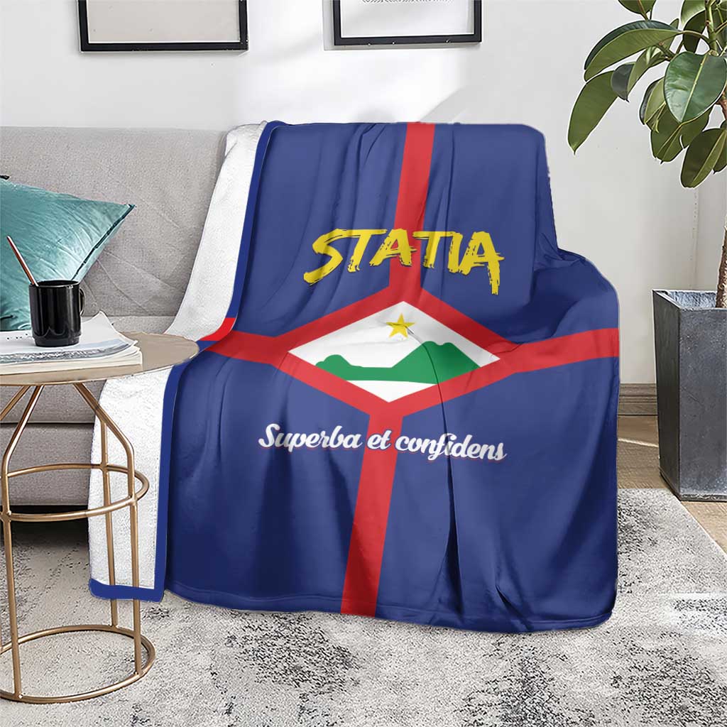 Blue Statia coat of arms blanket on a chair, with red cross and script slogan