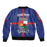 Blue bomber jacket back view with coat-of-arms crest and YOUR TEXT center