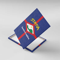 Blue canvas wall art with Statia coat of arms shield and red cross