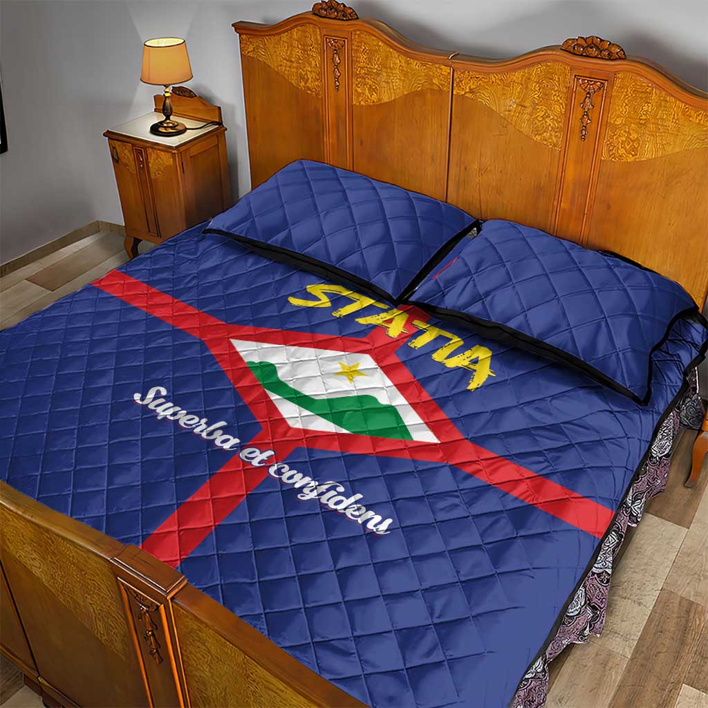 Blue quilt bed set with two pillowcases, STATIA crest with red cross and black trim accents