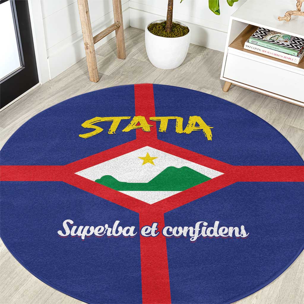 Round blue rug with red cross, coat of arms, yellow STATA, and “Superba et confidenS”