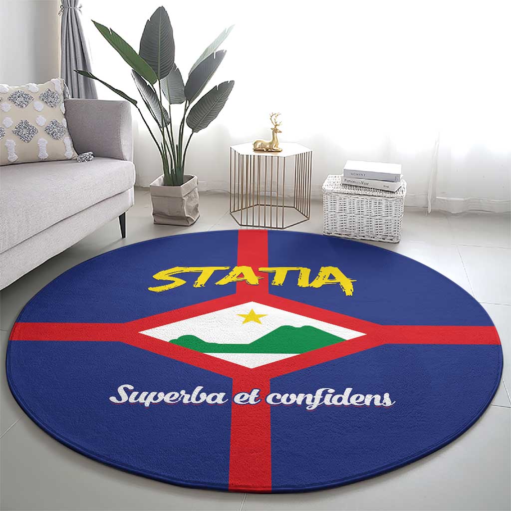 Round blue rug with large STATA and coat of arms design, red cross border, script text