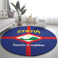 Round blue rug with large STATA and coat of arms design, red cross border, script text