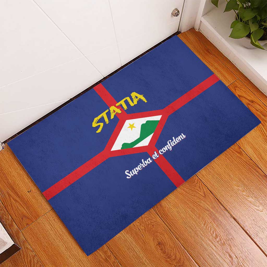 Blue rubber doormat at angle, with coat of arms and STATIA lettering