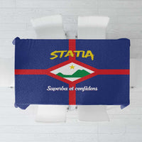 Blue tablecloth with red cross and crest emblem design center panel.