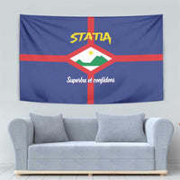 Blue tapestry wall hanging featuring red cross, white shield crest, and yellow STATIA on top