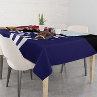 Navy tablecloth draped over corner of table, featuring koala and kangaroo scene