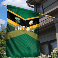 Jamaica garden flag on yard pole, green and gold chevron design with Jamaica text