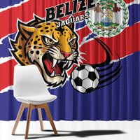 Close-up blue curtain with Belize flag stripe, Jaguars logo, and soccer ball print