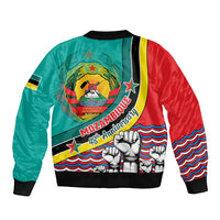 Teal and red bomber jacket with Mozambique crest, “48th Anniversary” text, and ribbed cuffs