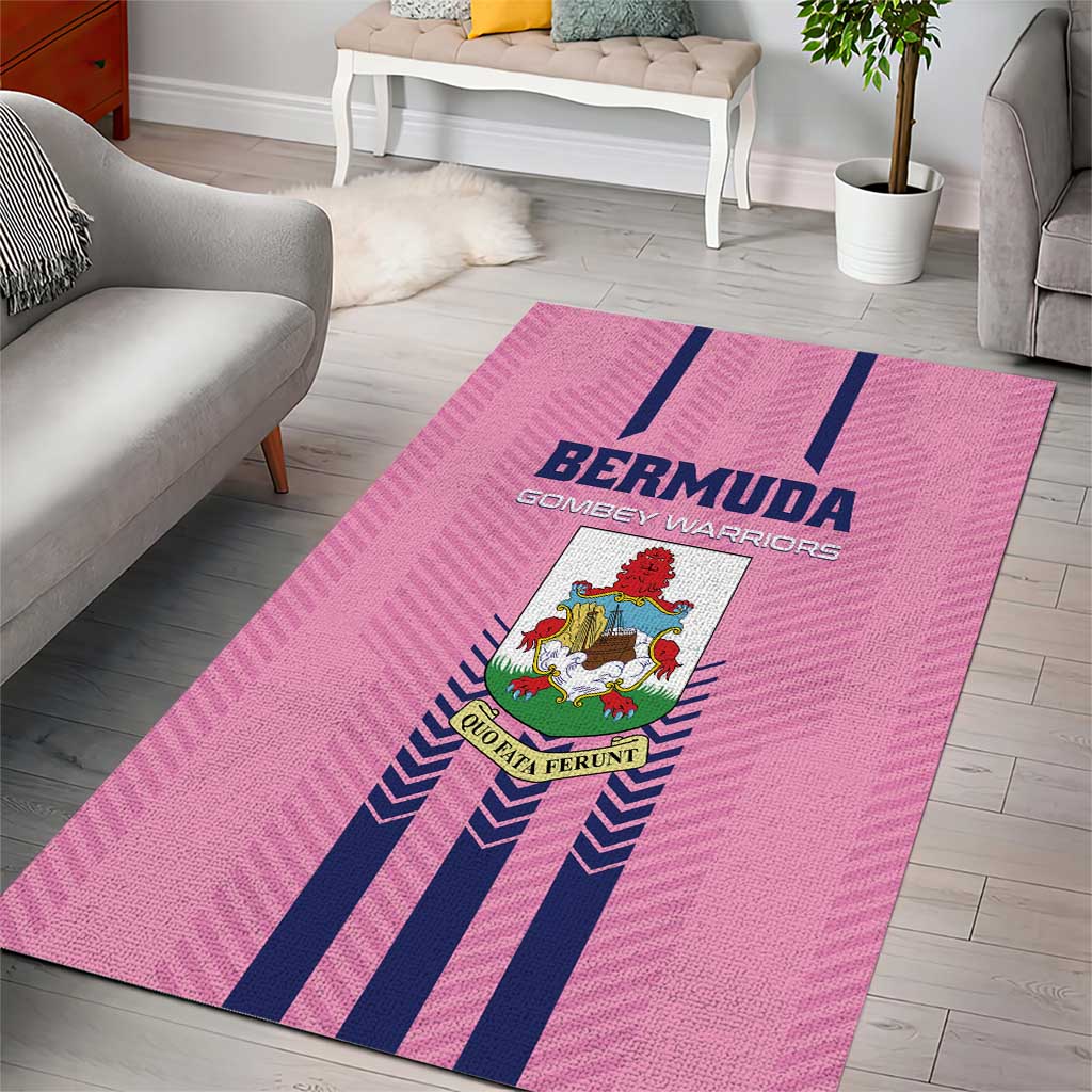 Pink area rug with navy stripes and centered Bermuda crest logo on the floor