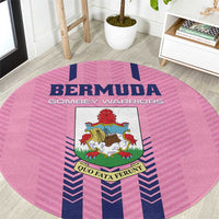 Pink round area rug with Bermuda Gombey Warriors crest and blue chevron stripes