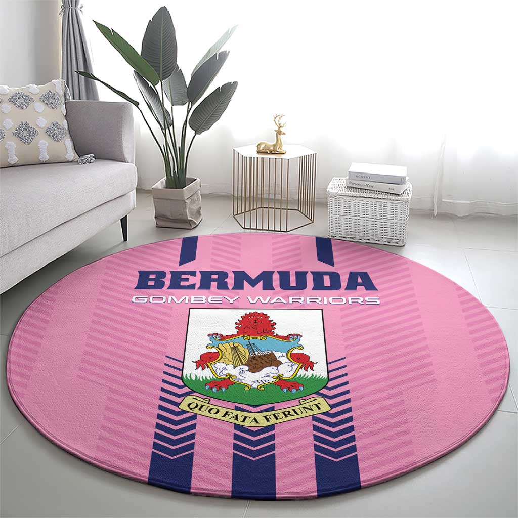 Pink round area rug with Bermuda text and crest center, blue vertical stripe accents