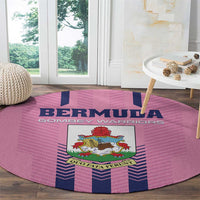 Pink round rug with Bermuda crest and blue chevron bands
