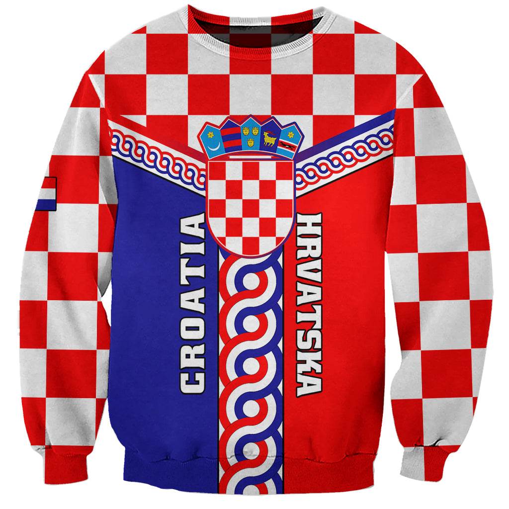 Red, white, blue checkered sweatshirt with crest and interlace coat-of-arms panel