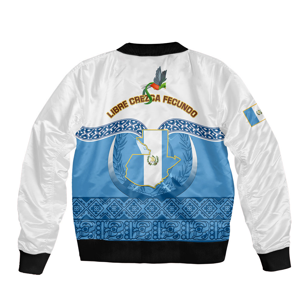 White and blue bomber jacket with central coat of arms, blue Maya-style bands on back