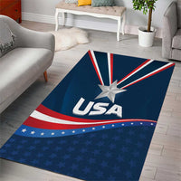 Blue patriotic area rug with “USA” text, central star, red and white stripes, small stars