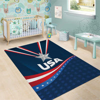 Blue kids area rug with “USA” lettering, central star, and red-white stripes with starry field