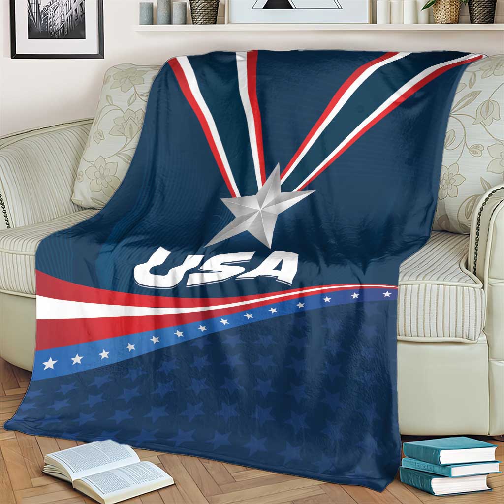 Blue USA-themed blanket on a couch seat, showing star emblem and USA lettering