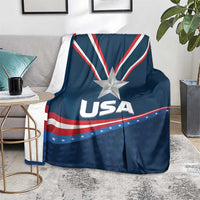 Blue USA-themed blanket draped on a sofa, with star emblem and USA lettering