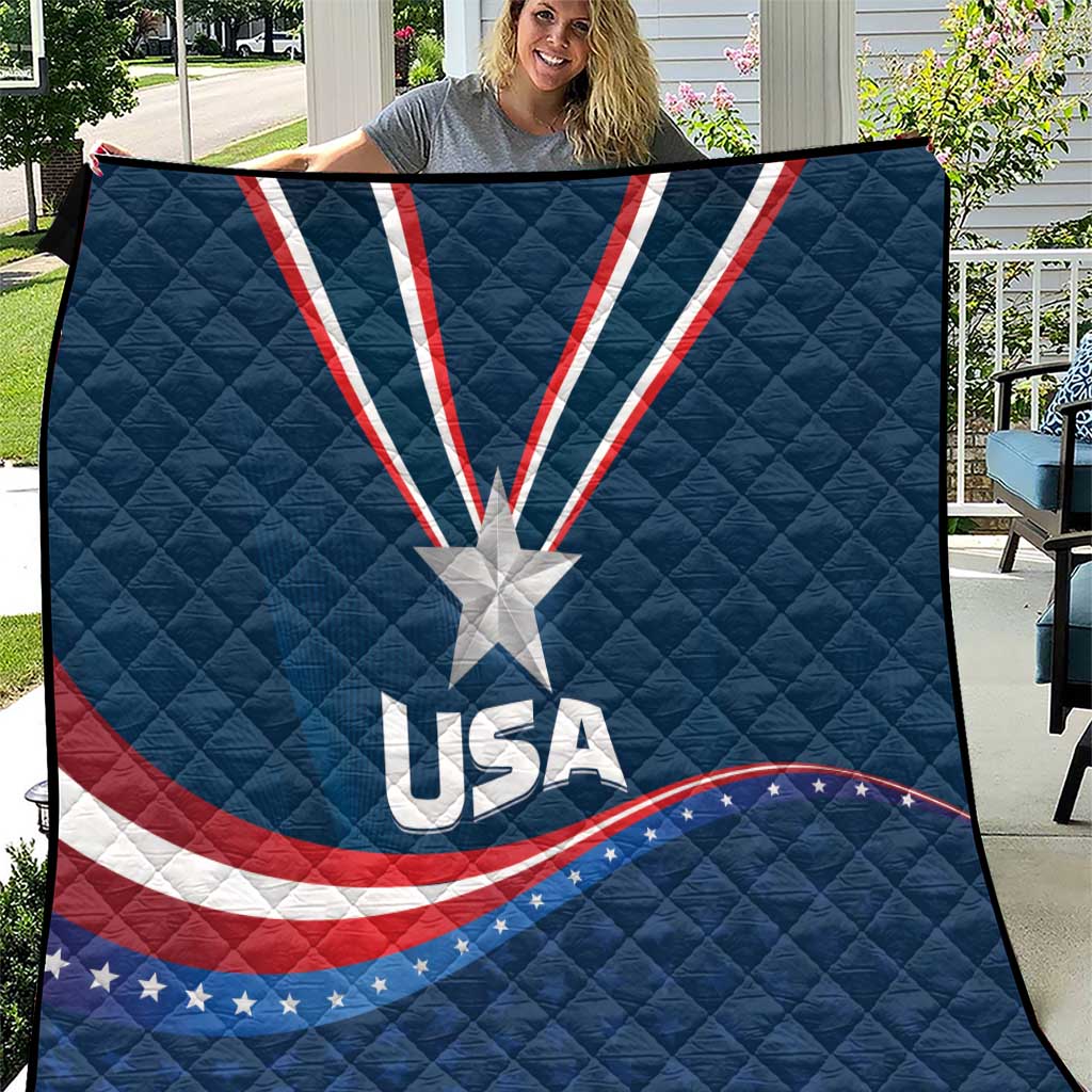 USA star medal quilt with blue backing, white star, and red-and-white wave stripes