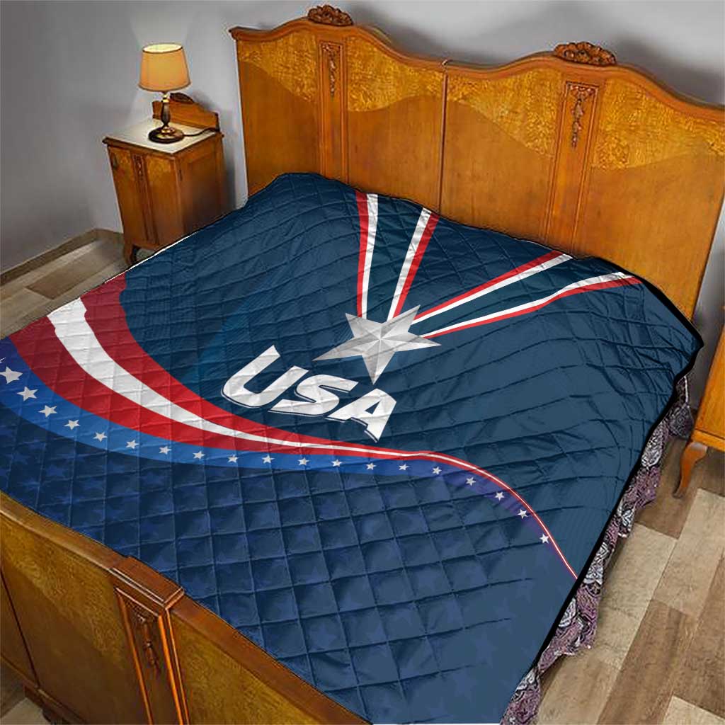 USA star medal quilt on bed, blue cover with large white star and red/white wave stripes