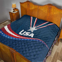 USA star medal quilt on bed, blue cover with large white star and red/white wave stripes