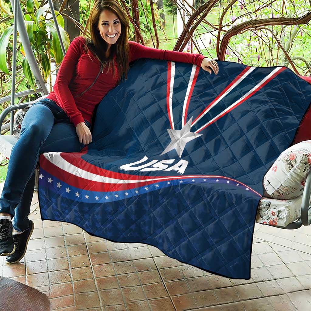 USA star medal quilt draped on patio, blue with white star and red/white wave stripes
