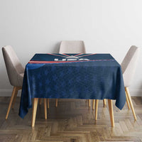 Navy blue tablecloth with USA star medal graphic and red stripe border on tabletop