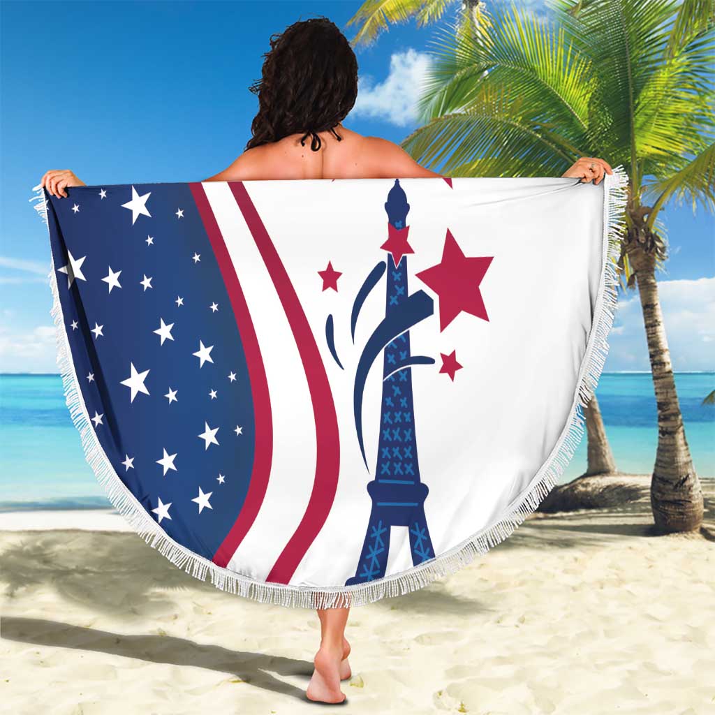 Round USA beach blanket with navy stars, red stripes, Eiffel Tower graphic, white fringe