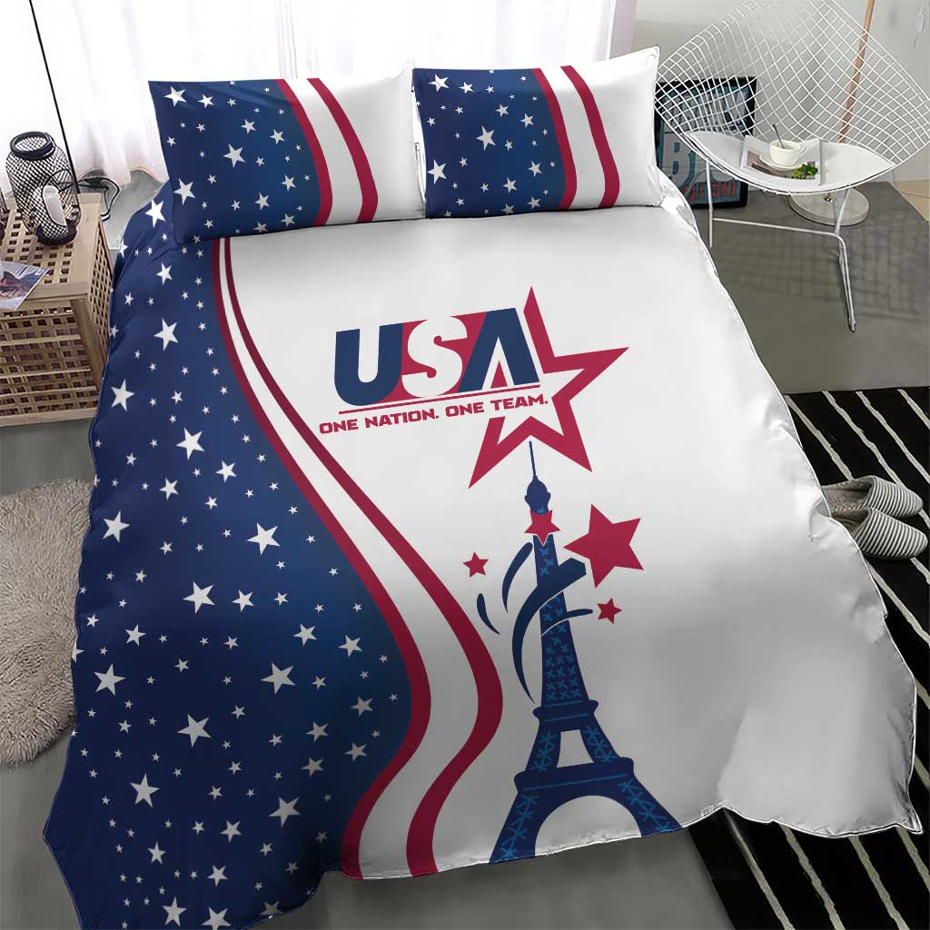 Close-up bedding set with blue star field, red stripes, and Eiffel Tower centerpiece on duvet