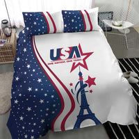 Close-up bedding set with blue star field, red stripes, and Eiffel Tower centerpiece on duvet