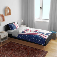 Blue and white bedding set with Eiffel Tower print and star-and-stripe pillow accents