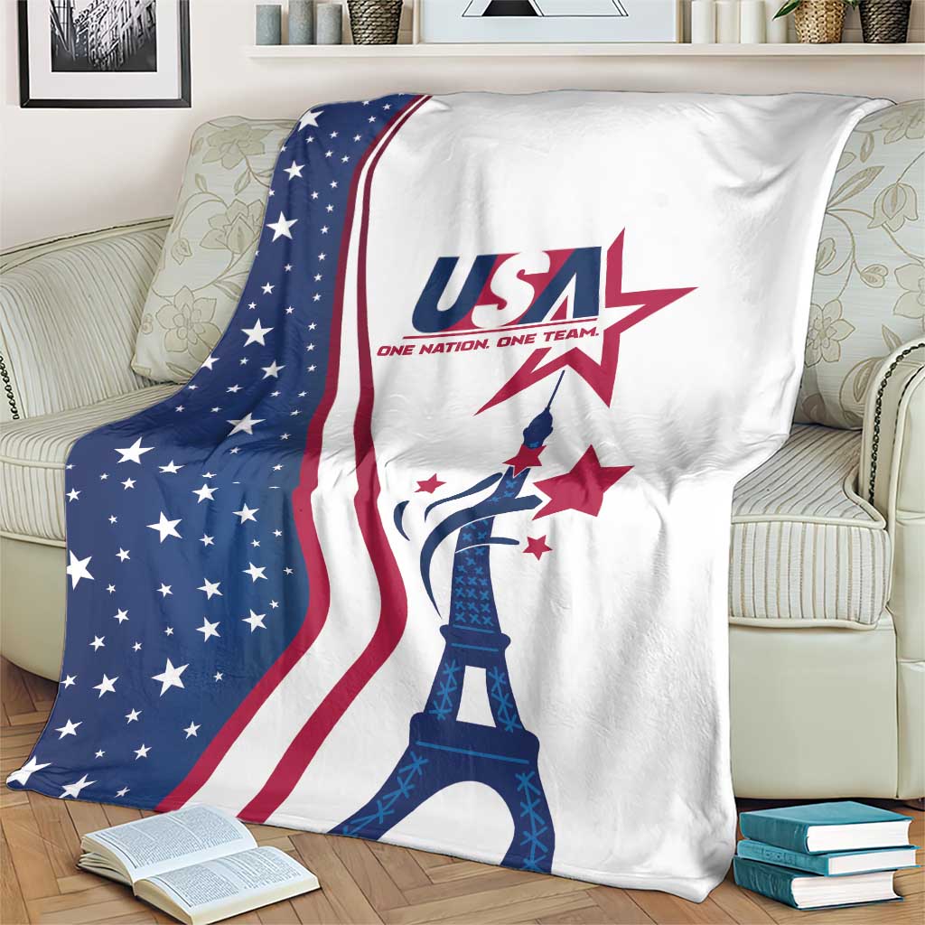 White and blue USA Eiffel Tower blanket with red flag stripes, shown on couch with pillows