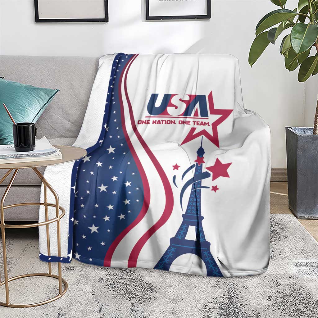 USA Eiffel Tower blanket in white with blue star field and red stripes, draped on gray sofa
